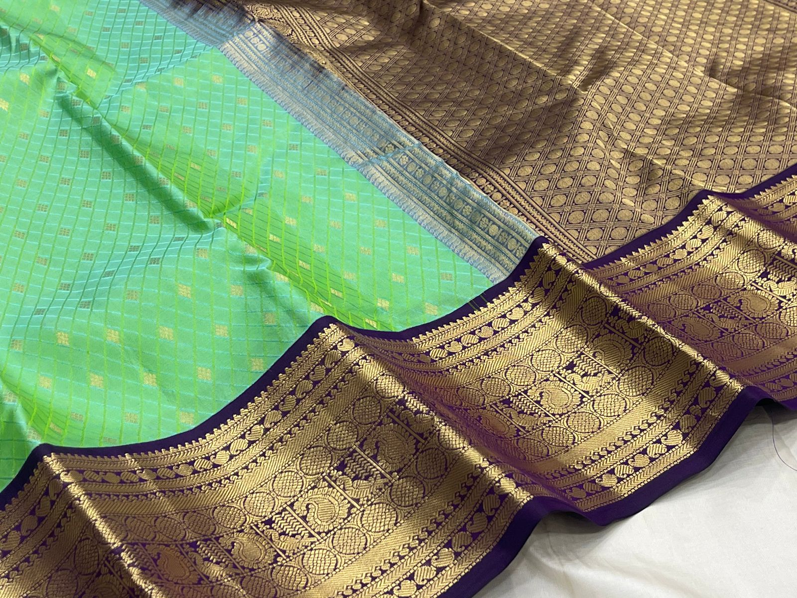 Rani Pink Kanjivaram Silk Saree with a Contrast Purple Zari Border.